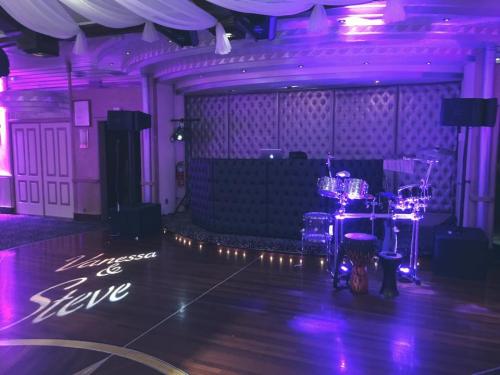 Our most popular set up.
Our custom Black tufted front board & JBL Sound System
Percussion Set & Name in Lights.